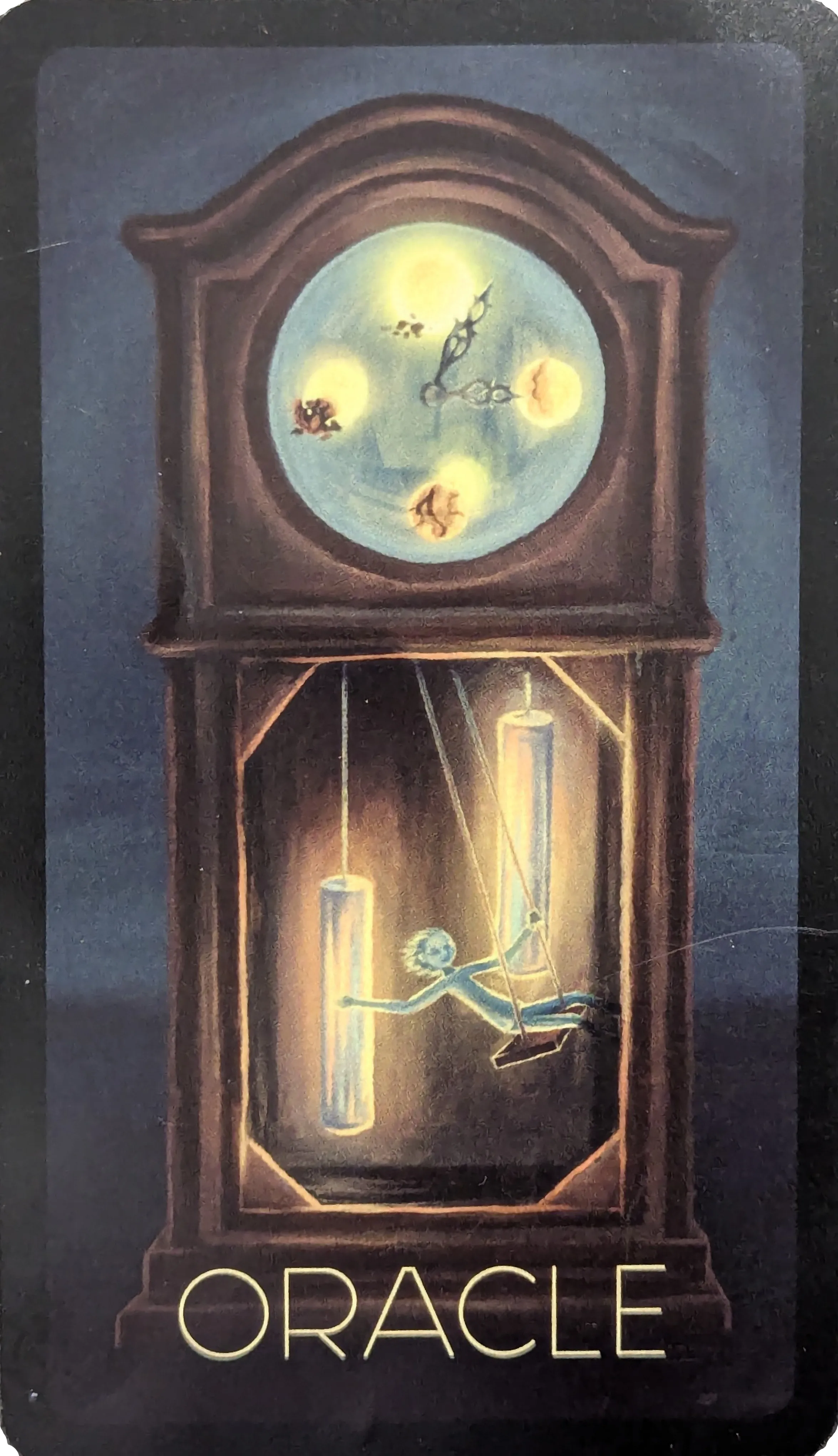 A card with artwork of a childish figure on a swing inside a grandfather clock and the text Oracle.