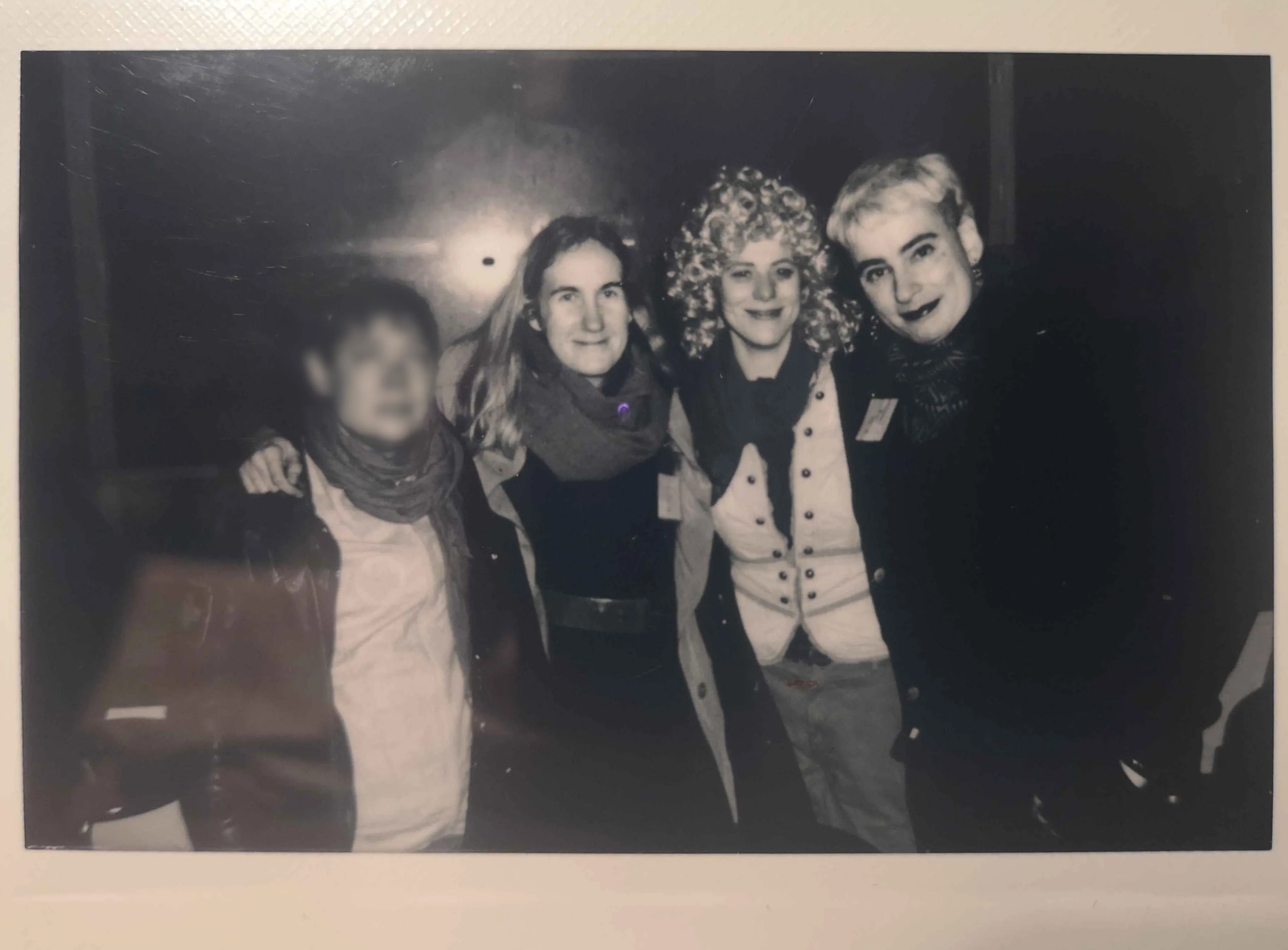 Black and white polaroid of the four people in the Time cluster.