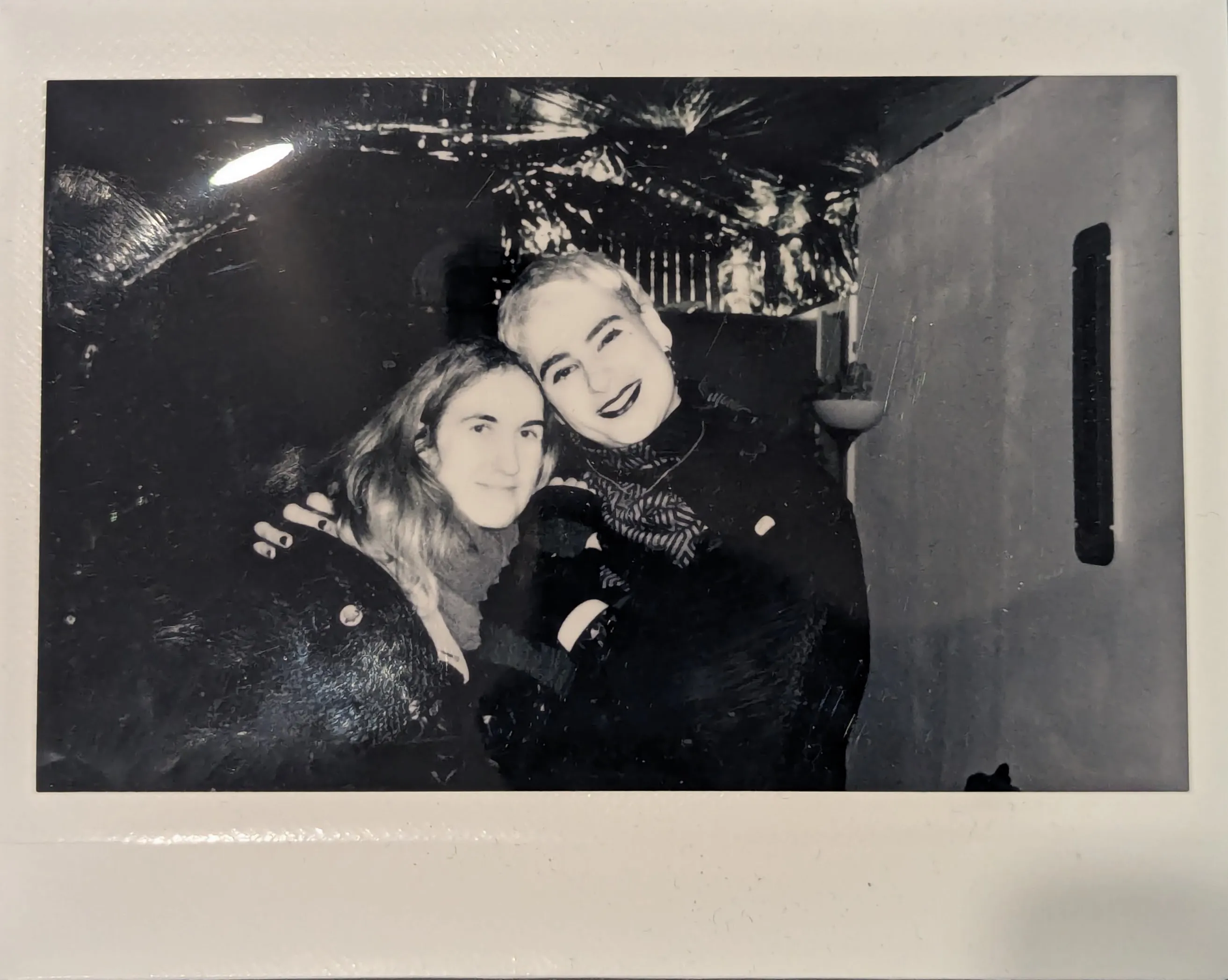 Black and white polaroid of Wisp and Ostinato.